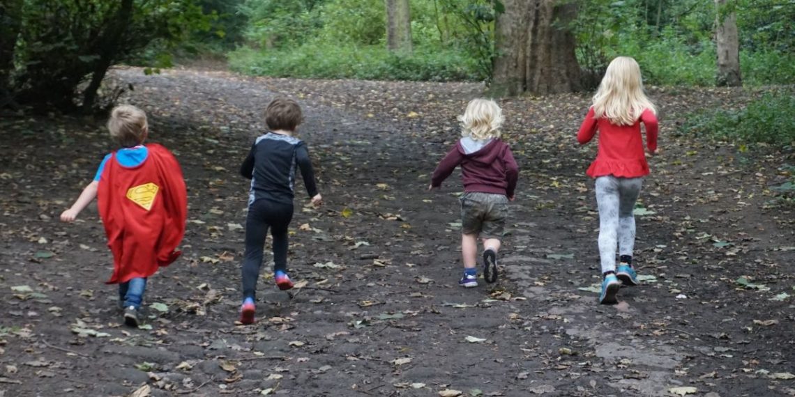 balancing outdoor play and screen time running in the woods